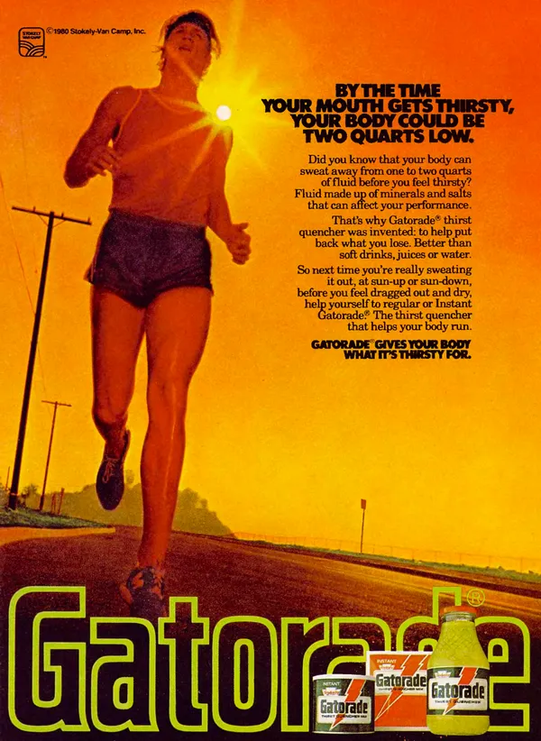 A runner moving along a sunlit road beside a large orange Gatorade headline and images of regular and instant Gatorade packages.