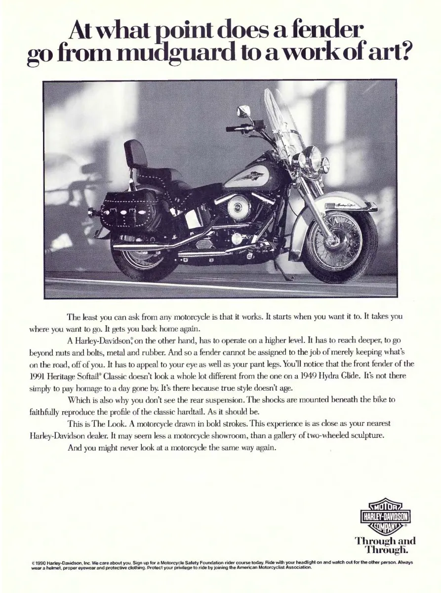 Side view of a 1991 Harley-Davidson Heritage Softail Classic, with a large question about its sculpted front fender above the motorcycle.