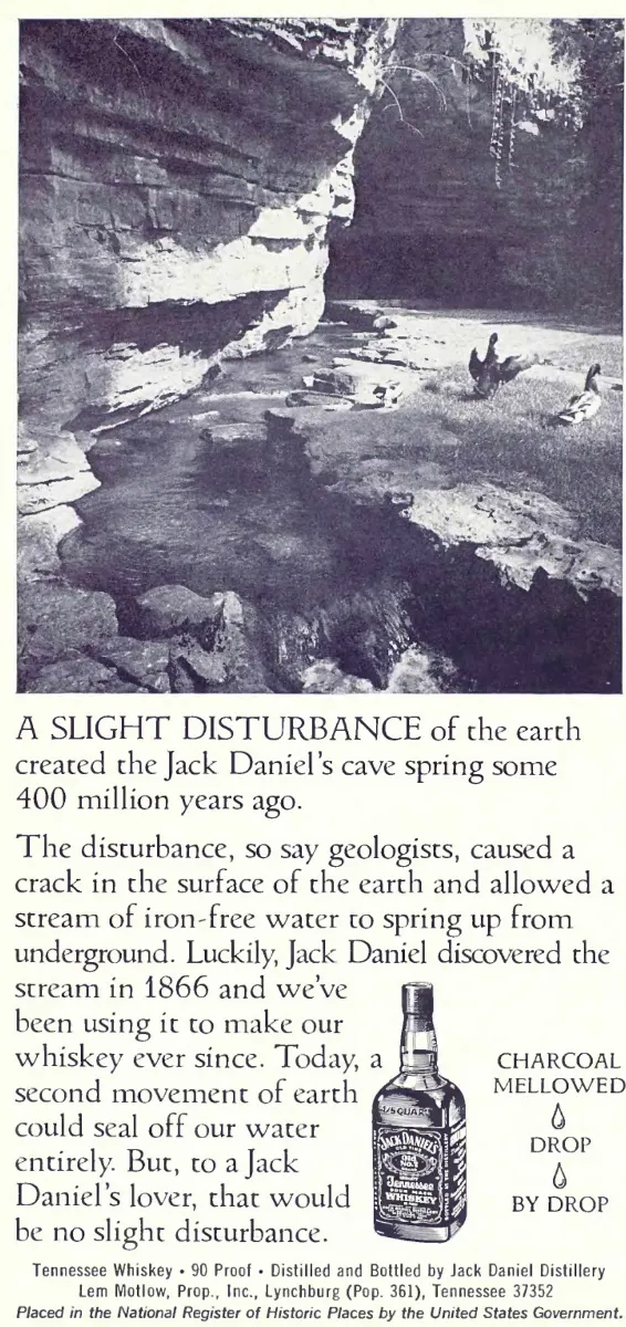 Black-and-white photograph of Jack Daniel's cave spring above a story about its water, with a whiskey bottle at the foot of the page.