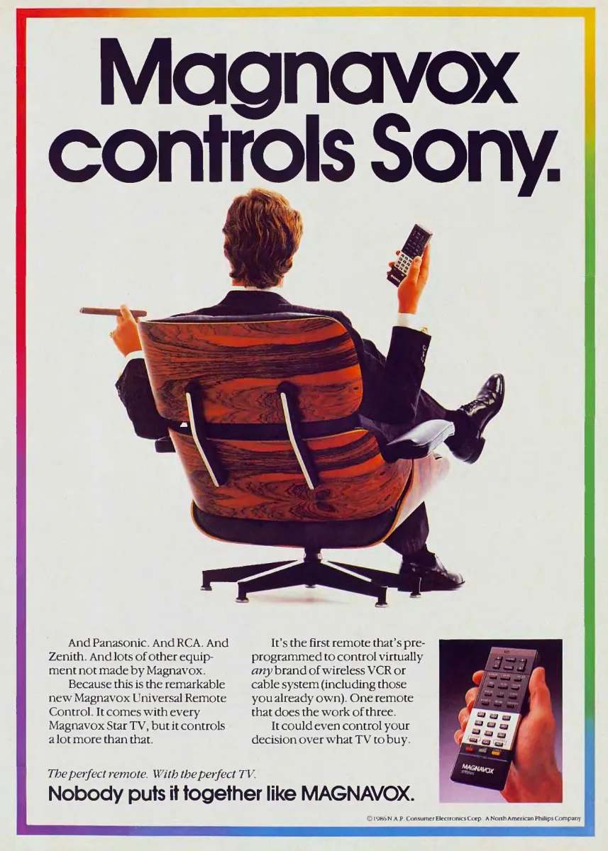A man seen from behind in a wood-backed lounge chair holds a cigar and Magnavox remote beneath the headline Magnavox controls Sony.