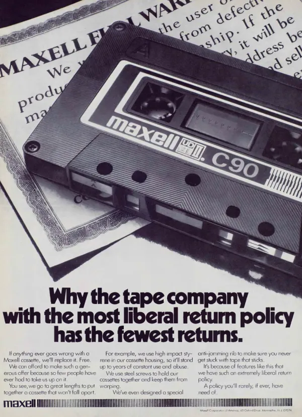 A Maxell C90 cassette lies diagonally across a printed warranty document, above a bold headline about returns.