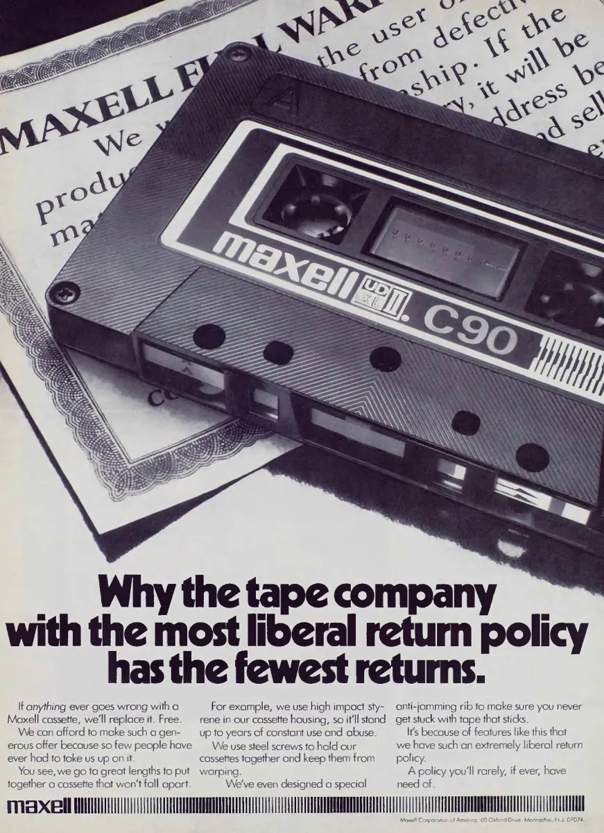 A Maxell C90 cassette lies diagonally across a printed warranty document, above a bold headline about returns.
