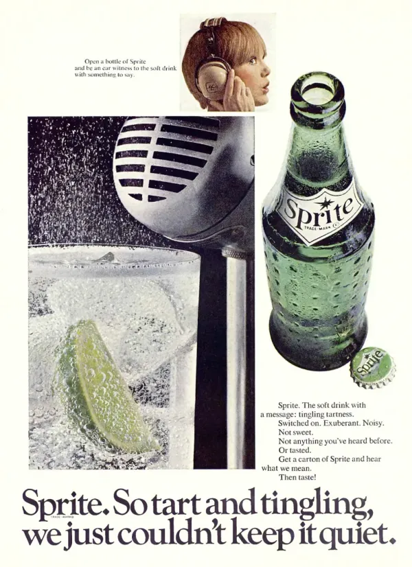 Sprite ad with a green glass bottle and cap beside a fizzing glass, a large microphone, and a child listening through a cup held to their ear.