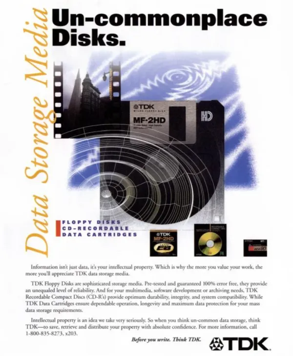 TDK data storage ad places a large floppy disk over a city and circular graphic, with smaller CD-R and cartridge images below.