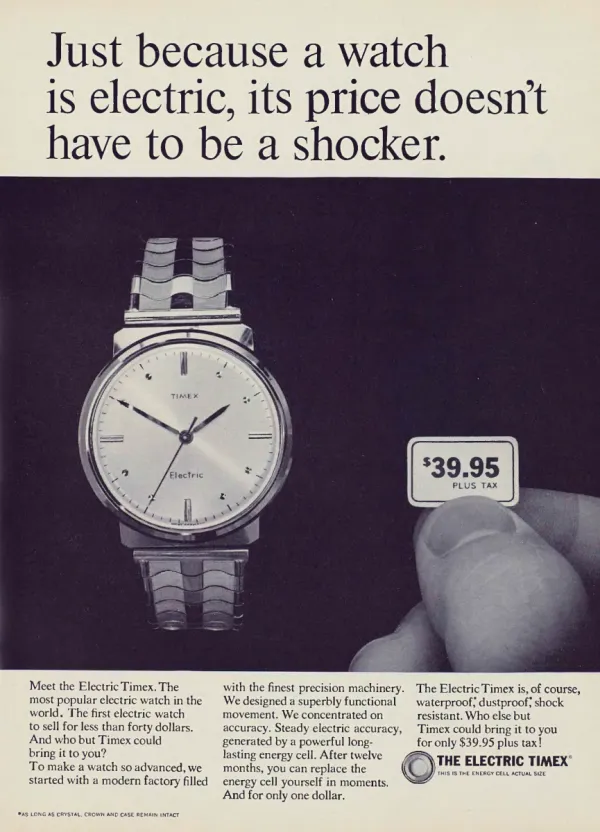 A large Electric Timex wristwatch appears against a dark background beside fingers holding a $39.95 price card.
