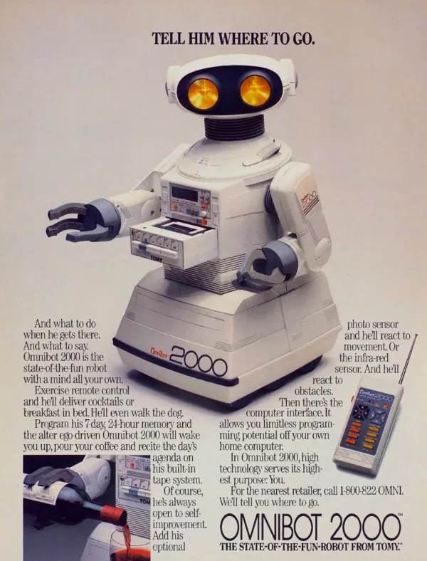 A white Omnibot 2000 robot with glowing amber eyes, cassette controls and gripping arms dominates the page beside its remote; an inset shows it pouring a drink.