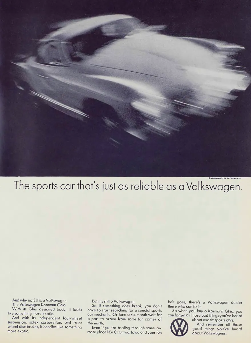 Blurred black-and-white Karmann Ghia in motion above a large white field, headline, and three columns of Volkswagen copy.
